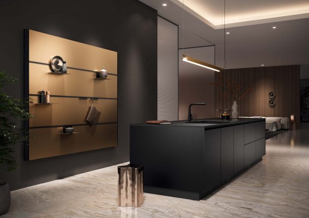 Schwarze Inselküche von Häcker Küchen mit goldfarbenem Wandpaneel erhältlich bei KÜCHE kreativ